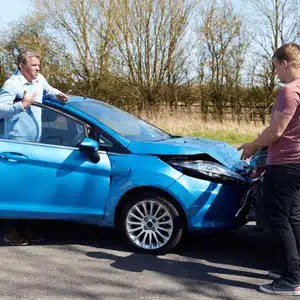 Drivers debate fault after car crash, raising a potential word vs word insurance claim