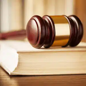 Court gavel on law book symbolizes how long do you have to contest a will in Texas