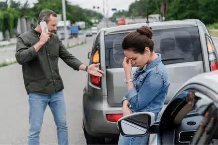 Emotional drivers argue after collision, facing possible word vs word insurance claim situation soon