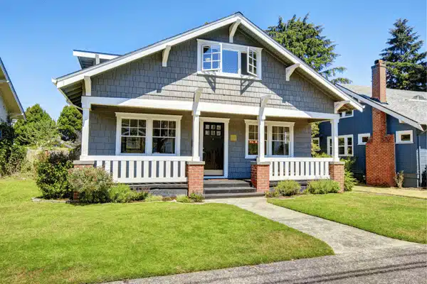 A gray house with white trim represents intestate succession Texas property inheritance without a will